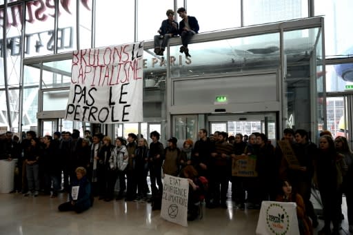 Activists formed a human chain to protest Black Friday sales at a shoping mall in the La Defense business district west of Paris, France, on Friday