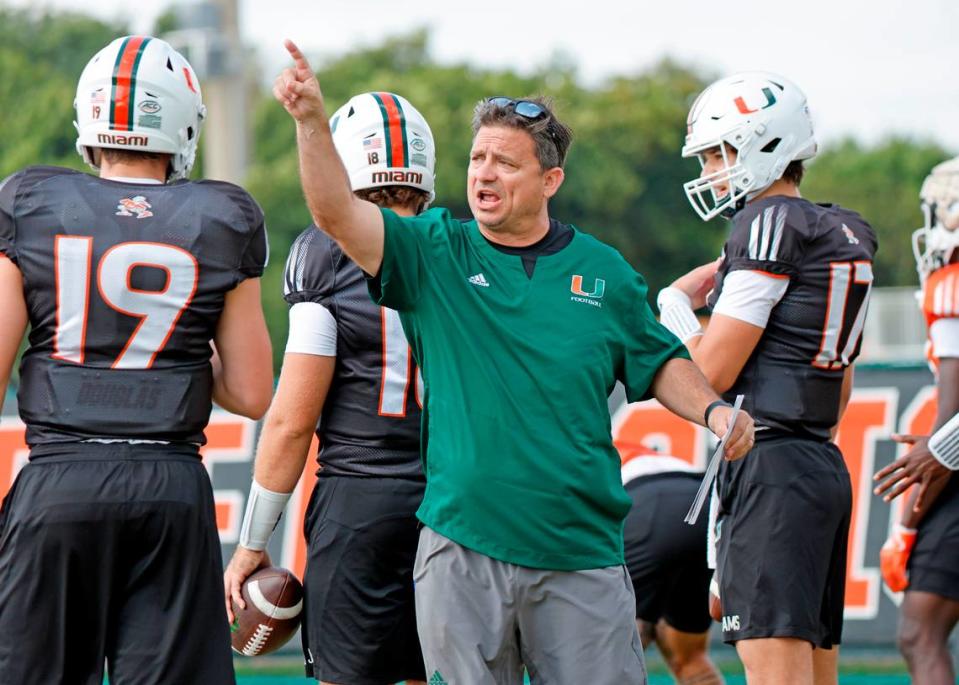 Miami Hurricanes offensive coordinator Shannon Dawson works with the quarterbacks during practice at the University of Miami’s Greentree Field on Thursday, March 9, 2023.