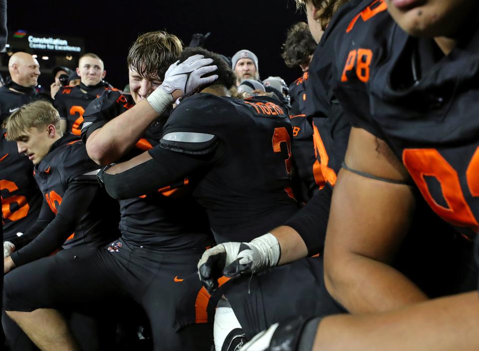 Massillon players celebrate after winning the OHSAA Division II state championship Thursday in Canton.