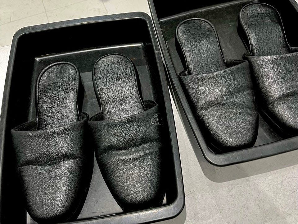Slippers in bins at airport in Japan