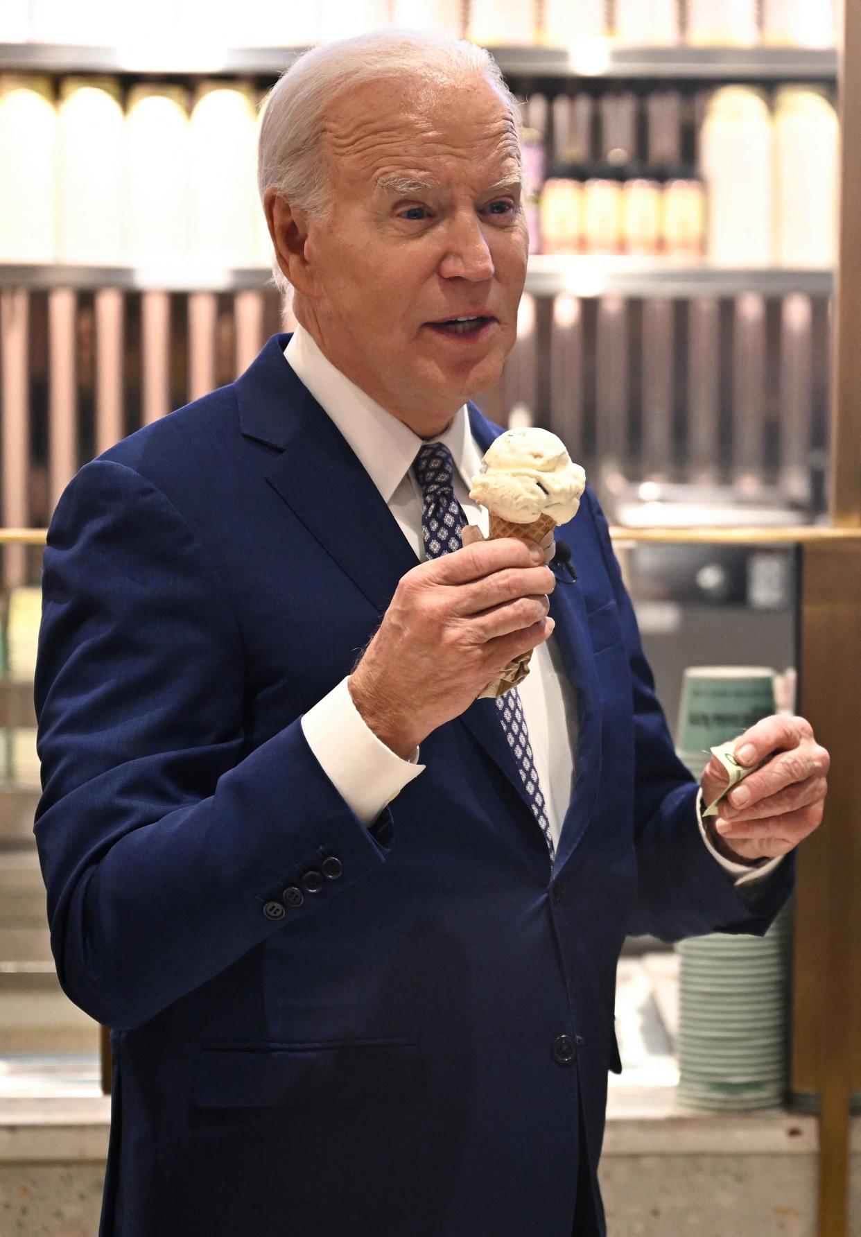 President Joe Biden enjoys an ice cream cone at a Van Leeuwen ice cream shop in New York City after taping an episode of "Late Night with Seth Meyers."