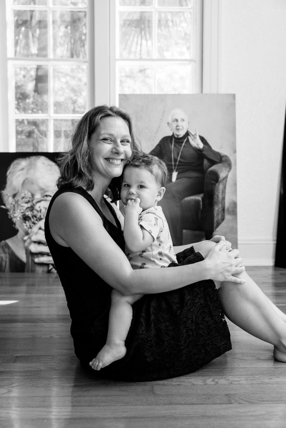 Photographer Becki Rutta, shown with her baby, captures the bold beauty of aging in portraits of "Women Among Us: Portraits of Strength," showing at LeMoyne Arts through Oct. 28, 2023.