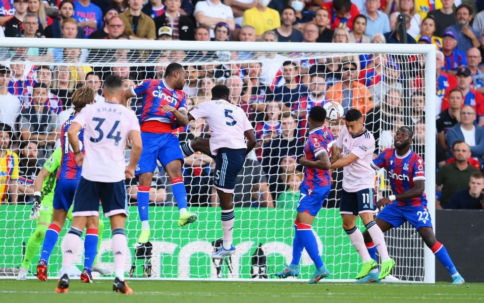 Gabriel Martinelli of Arsenal scores their side's first goal whilst under pressure - GETTY IMAGES