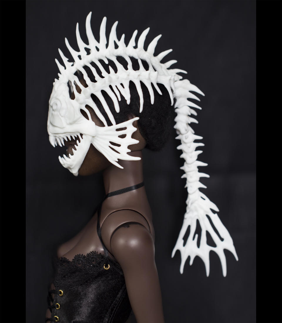 Hey, your Barbie probably gets bored of looking gorgeous in a plastic way. Allow that doll to express her inner monster with this <a href="https://www.shapeways.com/product/VYPE7PFNW/bjd-fish-skeleton-helmet" target="_blank">plastic mask </a>that will surely give Ken a scare.