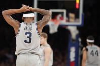 Georgetown guard James Akinjo (3) reacts after being called for a foul during the second half of the team's NCAA college basketball game against the Duke in the 2K Empire Classic, Friday, Nov. 22, 2019 in New York. Duke defeated Georgetown 81-73. (AP Photo/Kathy Willens)