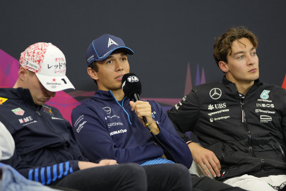 Williams driver Alexander Albon of Thailand speaks as Red Bull driver Max Verstappen of the Netherlands, left, and Mercedes driver George Russell of Britain listen during a news conference at the Suzuka Circuit in Suzuka, central Japan, Thursday, April 4, 2024, ahead of Sunday's Japanese Formula One Grand Prix. (AP Photo/Hiro Komae)