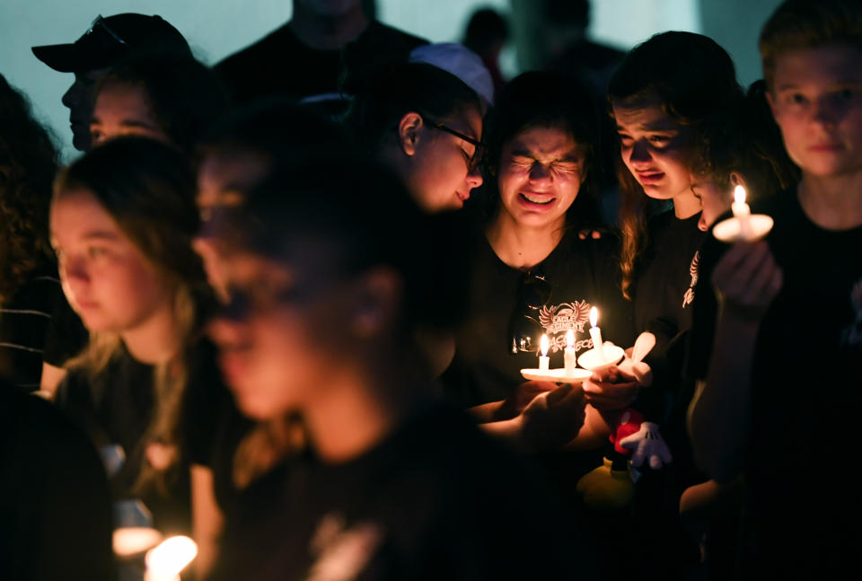 Students gather to honor of the victims of the school shooting in Parkland, Fla.