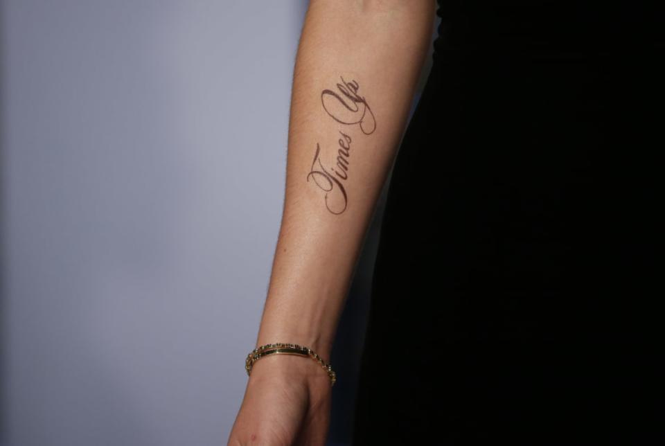 <div class="inline-image__caption"><p> Actress Emma Watson wears support for “Time's Up” on her arm at the Vanity Fair Oscars party in 2018.</p></div> <div class="inline-image__credit">Reuters</div>