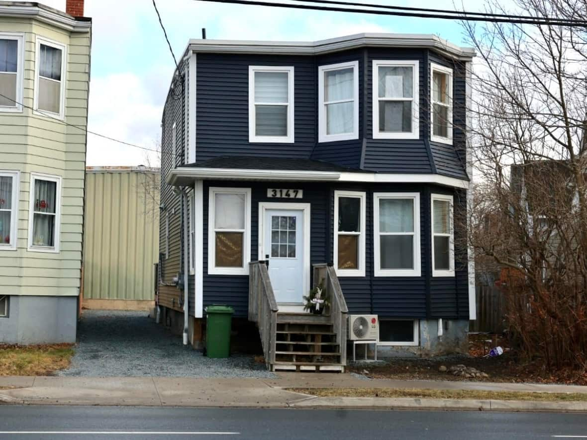 The man who died in a stabbing on Friday was allegedly involved in a home invasion at this address on Robie Street in the city's north end, according to police. (Robert Short/CBC - image credit)