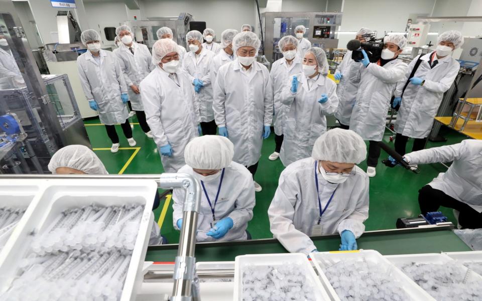 President Moon Jae-in inspects a LDS (low dead space) syringes plant in Gunsan, South Korea - Reuters