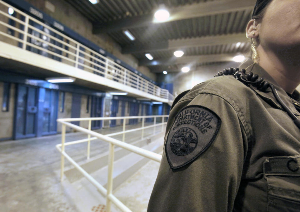 FILE - In this Aug. 17, 2011, file photo, a correctional officer works at one of the housing units at Pelican Bay State Prison near Crescent City, Calif. California officials approved the parole of Mexican Mafia prison gang leader, Rene Enriquez, Monday, July 18, 2022. (AP Photo/Rich Pedroncelli, File)