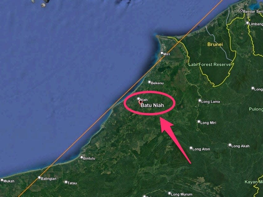 map shows region of borneo with orange line representing rocket booster path near Batu Niah