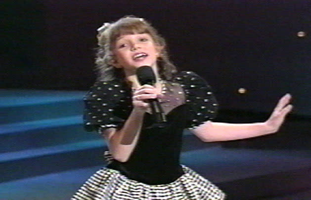 On Star Search. With the funny short-bangs-curls hair we all once
had.