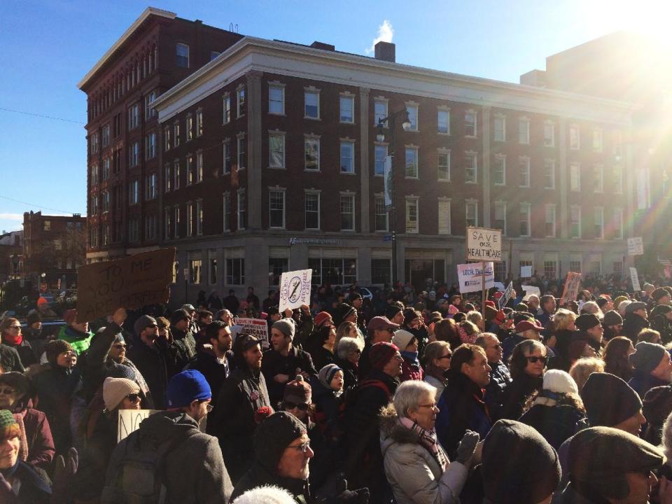 Hundreds of people attend a rally in support of the Affordable Care Act, Sunday, Jan. 15, 2017, at Portland City Hall, in Portland, Maine. Similar rallies took place around the country. (AP Photo/Patrick Whittle)