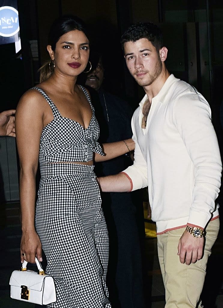 Indian Bollywood actress Priyanka Chopra (L) and US singer Nick Jonas (R) stand together in Mumbai on June 22, 2018. -  (Photo by - / AFP)        (Photo credit should read -/AFP/Getty Images)