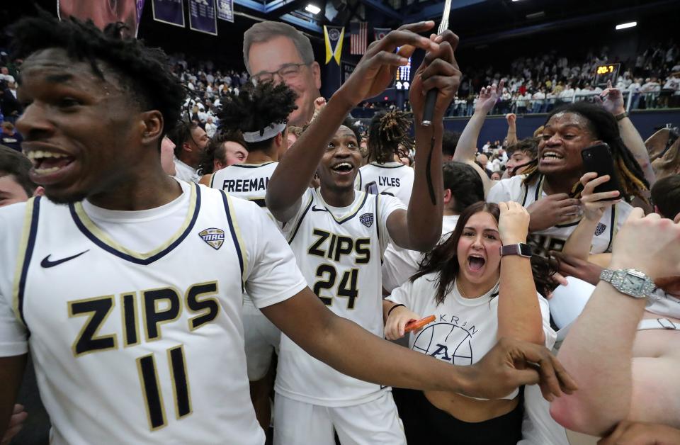 Akron Zips guard Ali Ali (24) celebrates with the Ak-Rowdies after beating Kent State in an NCAA college basketball game, Friday, Feb. 23, 2024, in Akron, Ohio.