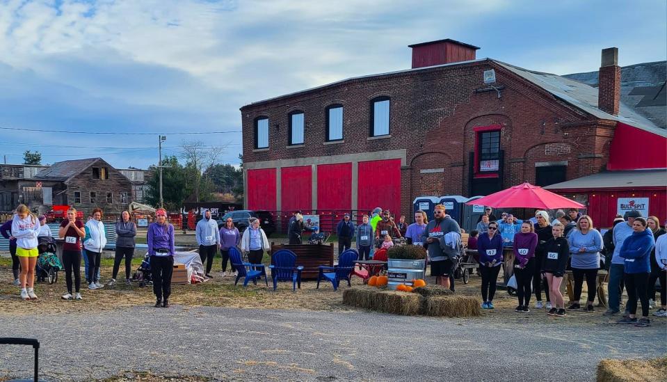 People gathered at Bull Spit's Bull Yard last November for an event. The foundry in the background is where the brewery hoped to open its taproom and brewery, but the project has stretched on for over three years.