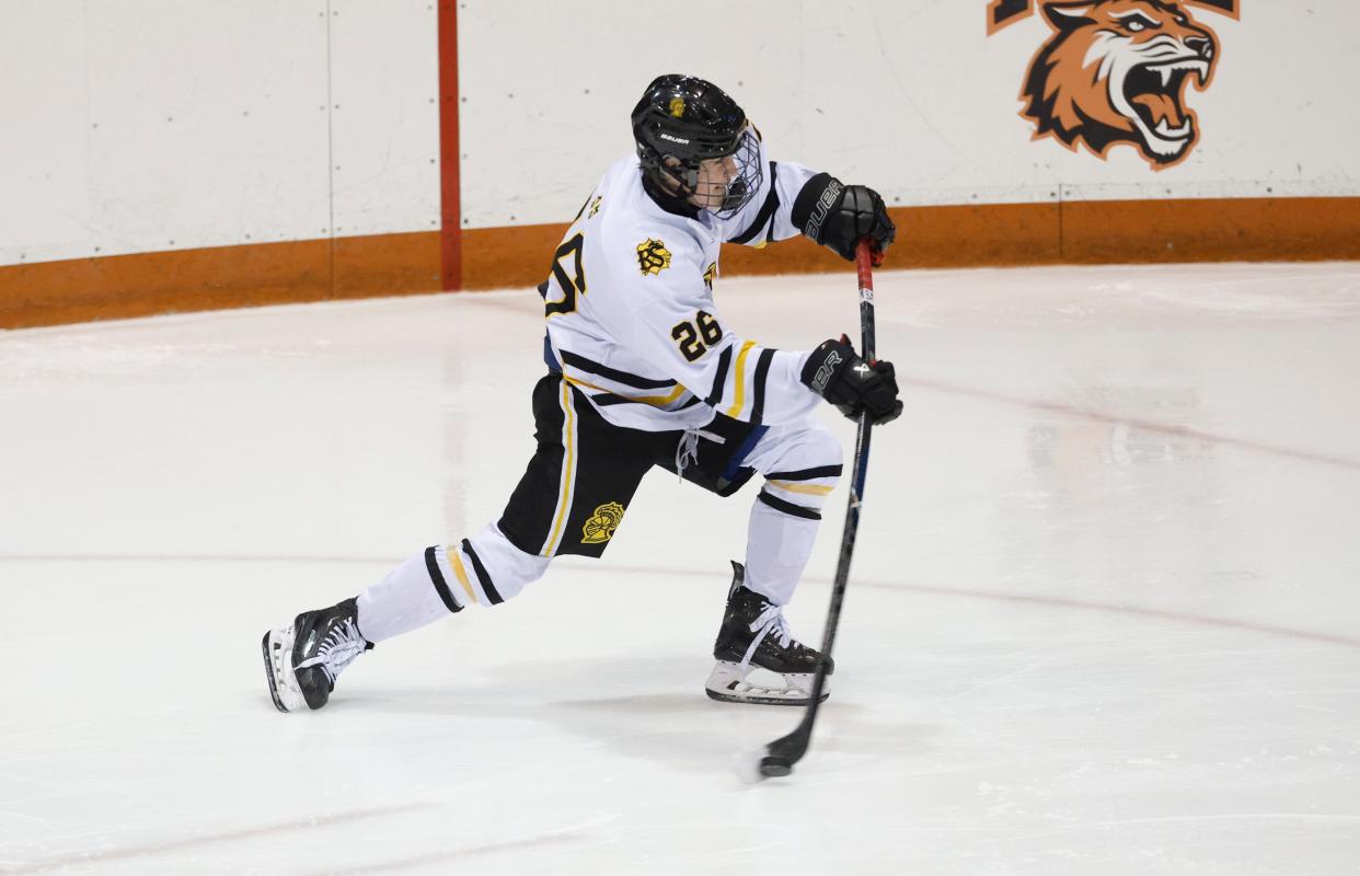 McQuaid’s Chase Brock scores on this shot against Portside.