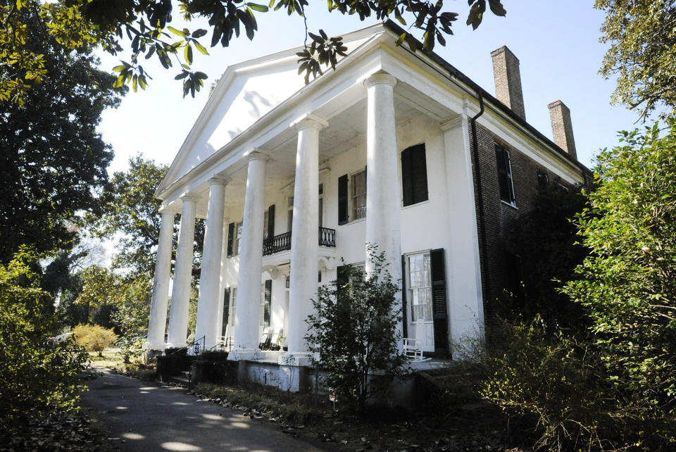 In this Jan. 30, 2020 photo, the Magnolia Grove, an antebellum plantation house in Greensboro, Ala., is seen. The home's entry in the National Register of Historic Places doesn't mention its ties to slavery even though visitors can see a display on enslaved people in an old slave dwelling. An Associated Press review found that many register entries for pre-Civil War plantations virtually ignore slavery. (AP Photo/Jay Reeves)