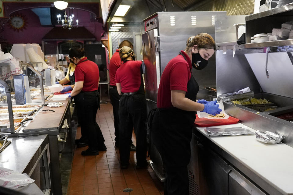 FILE - Employees work at a restaurant in Chicago, Thursday, March 23, 2023. The unemployment rate fell to 3.5% in March and more than 236,000 jobs were added. (AP Photo/Nam Y. Huh, File)