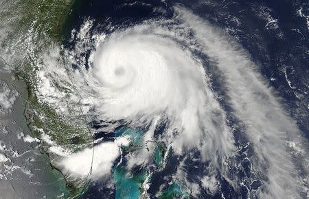 Tropical Storm Arthur -- now Hurricane Arthur -- is pictured off the Florida coast in this July 2, 2014 NASA satellite handout photo. REUTERS/NASA Goddard MODIS Rapid Response Team/Handout via Reuters