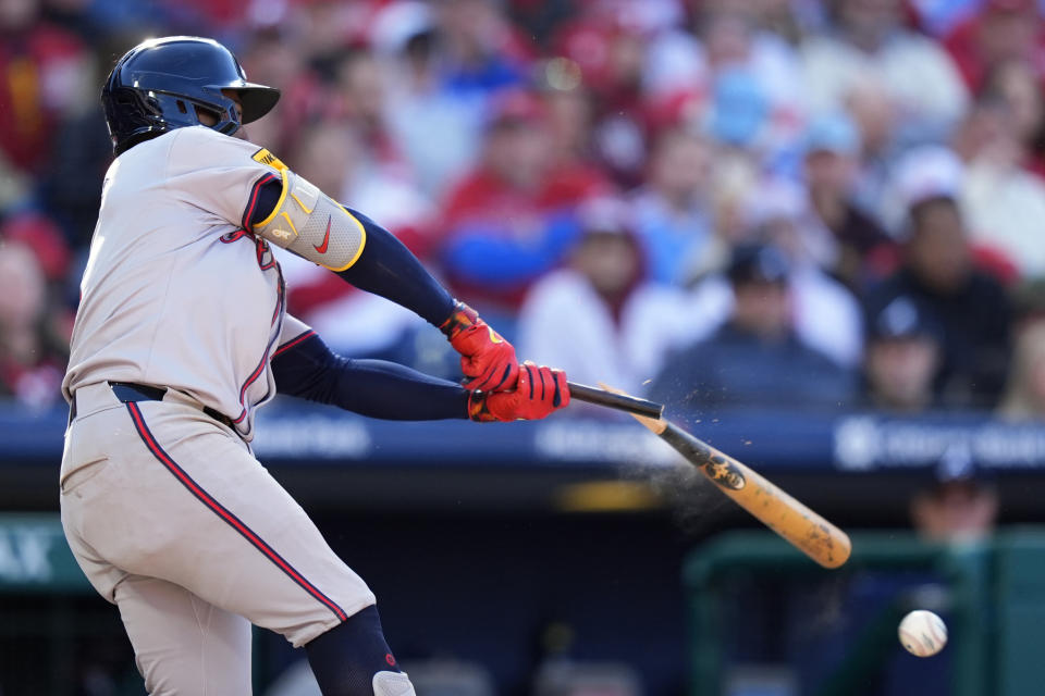 Atlanta Braves' Ozzie Albies breaks his bat on a ground out against Philadelphia Phillies pitcher Jeff Hoffman during the seventh inning of an opening-day baseball game, Friday, March 29, 2024, in Philadelphia. (AP Photo/Matt Slocum)