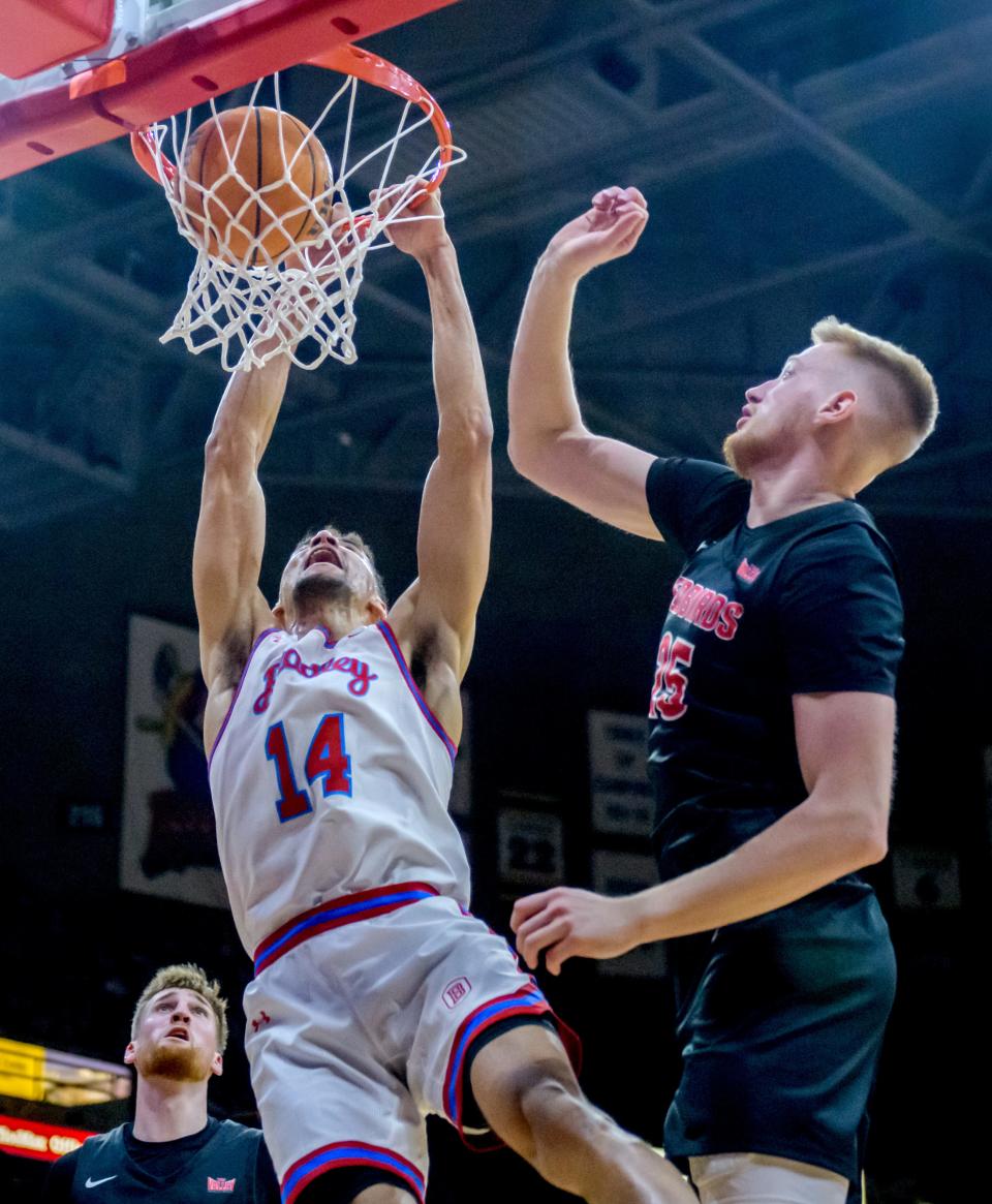 Bradley's Malevy Leons (14) dunks on Illinois State's Alex Kotov in the first half Wednesday, Jan. 25, 2023 at Carver Arena. The Braves downed the Redbirds 79-75 in overtime.