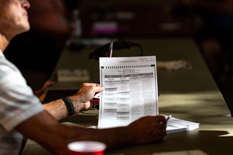 A person holding a sheet of paper