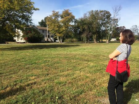 Mary Lettieri visits the patch of grass that used to be the house where she and her husband Frank raised their five children in Oakwood Beach neighborhood in Staten Island, New York October 23, 2017. REUTERS/Peter Szekely