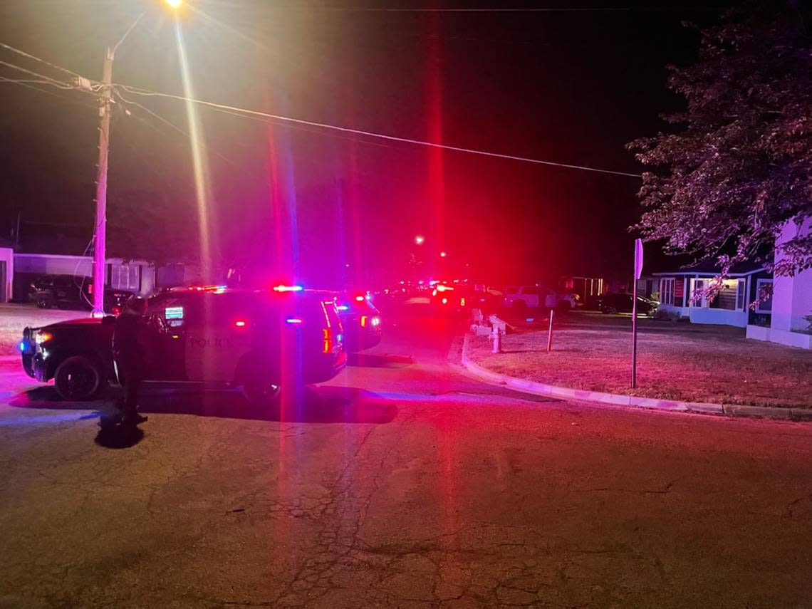 Police near the scene where officers shot and critically wounded a man Wednesday night following a domestic disturbance on Olive Place in west Fort Worth.