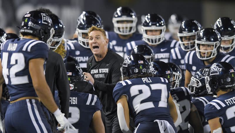 Utah State coach Blake Anderson talks to players during a timeout game against Colorado State on Oct. 7, 2023, in Logan.