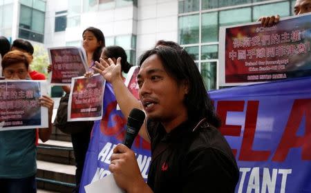 A demonstrator speaks during a protest over the South China Sea disputes outside the Chinese Consulate by members of the "Bayan" (Nationalist) activist group in Makati City, Metro Manila, Philippines July 11, 2016. REUTERS/Erik De Castro