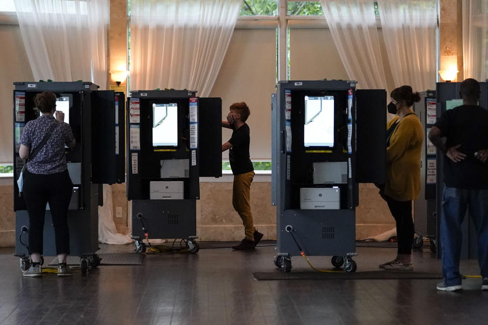 People vote in the Georgia's primary election on Tuesday, May 24, 2022, in Atlanta. (AP Photo/Brynn Anderson)