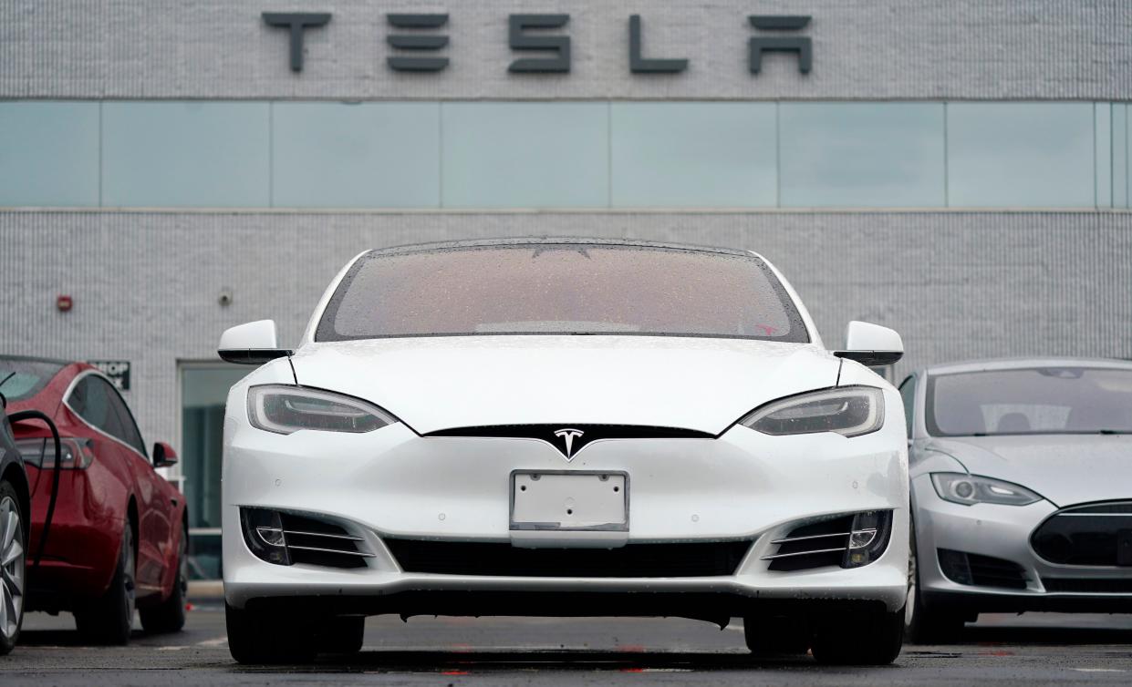 Tesla vehicles are parked at a company location in Littleton, Colo. 