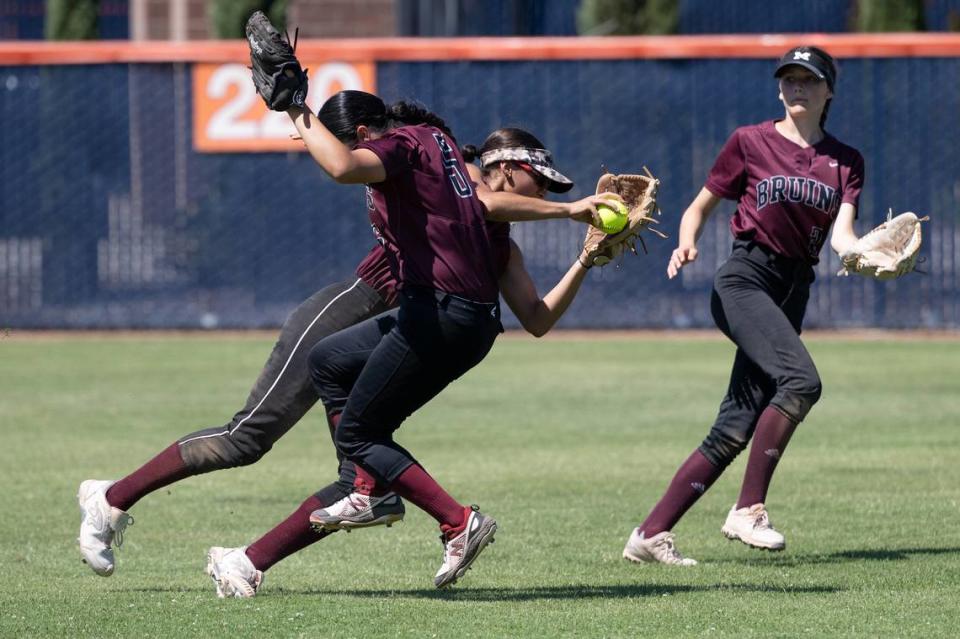 Riverbank shortstop Maya Guzman avoids colliding with teammate Desirae Vargas and holds on to the ball for out during the Sac-Joaquin Section Division VI championship game with Summerville at Cosumnes River College in Sacramento, Calif., Saturday, May 20, 2023. Summerville won the game 4-1.
