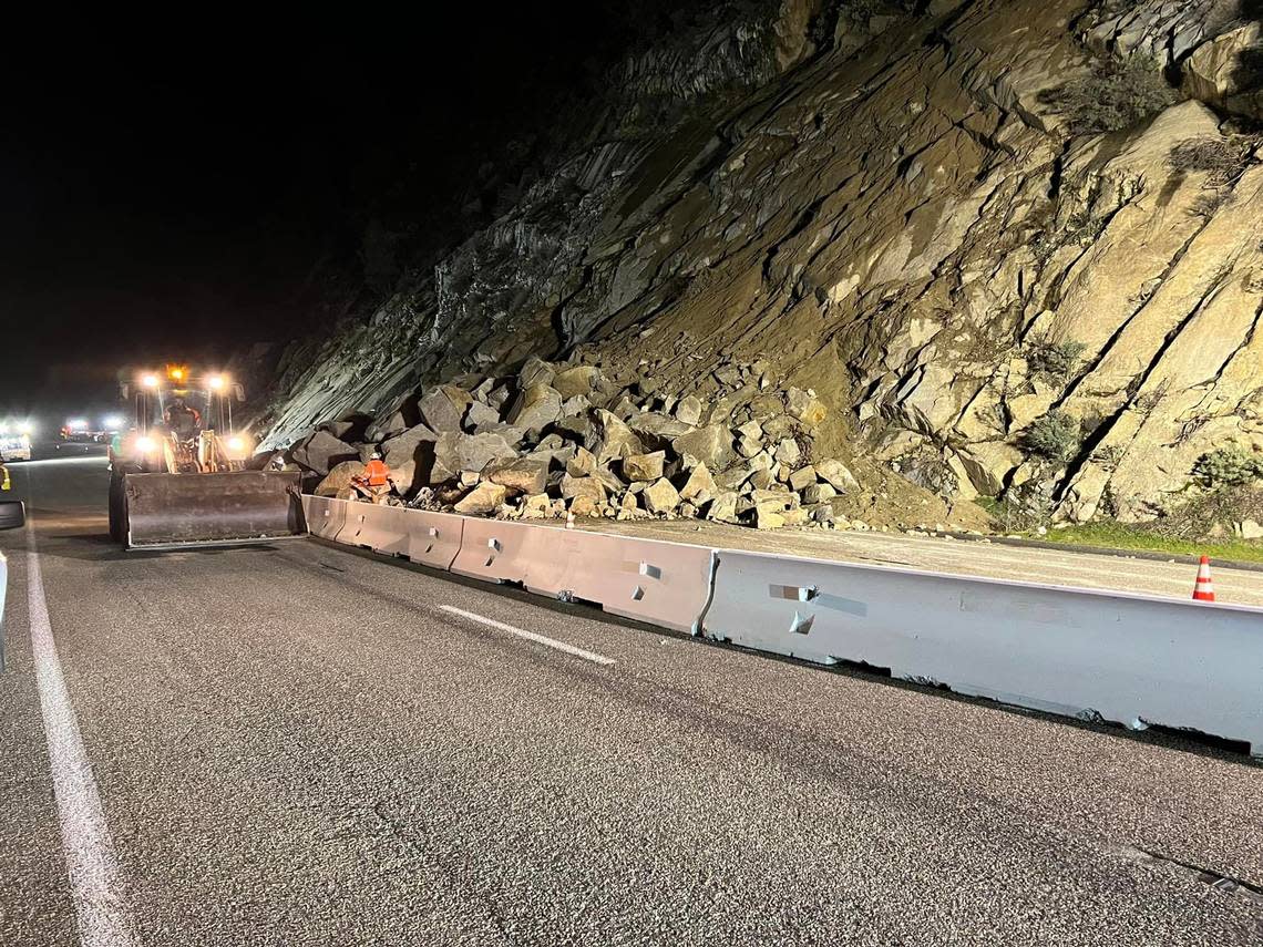 A K-Rail is being installed on Highway 168 adjacent to the fallen rocks as Caltrans works to reopen the route in eastern Fresno County.