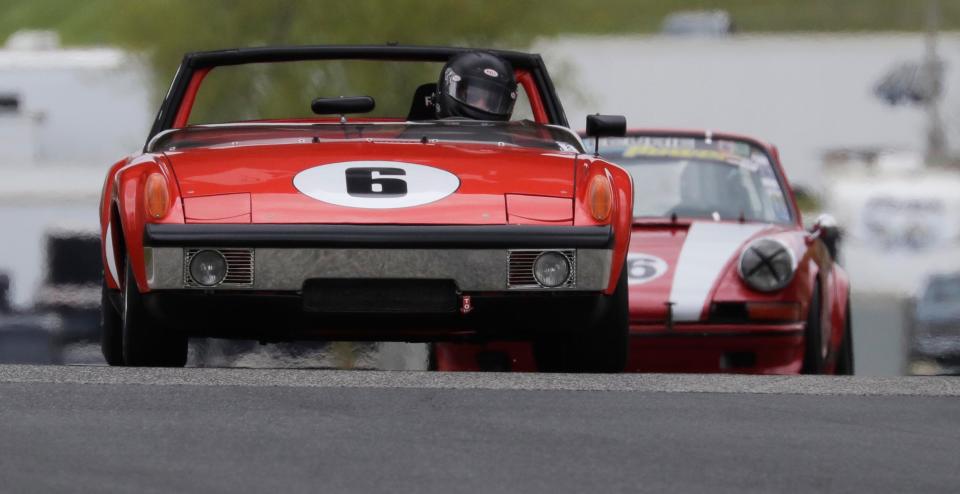 Joseph Hish (6) leads a pack of cars into turn 6 with his 1970 Porsche 914-6 during the SVRA Vintage Festival Weekend, Saturday, May 15, 2021, at Elkhart Lake's Road America near Plymouth, Wis.