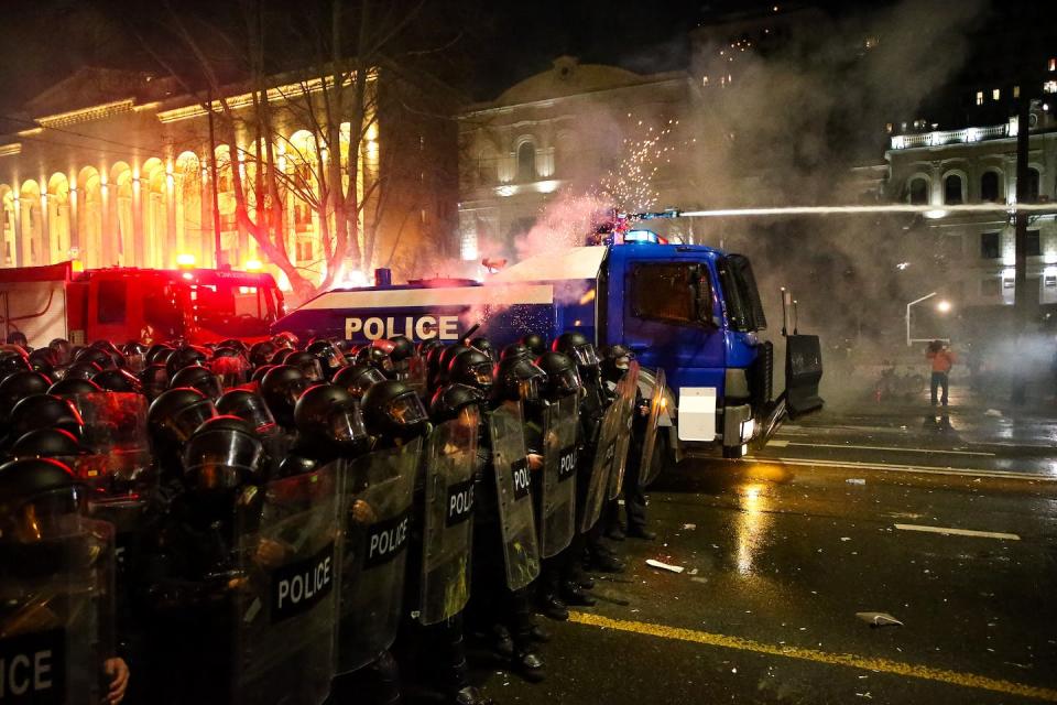 Protesters in Tbilisi, the capital of Georgia, face police in riot gear as they rally against the government’s planned foreign agent legislation. <a href="https://www.gettyimages.com/detail/news-photo/police-in-riot-gear-face-protesters-in-tbilisi-early-on-news-photo/1247923598" rel="nofollow noopener" target="_blank" data-ylk="slk:Zurab Tsertsvadze/AFP via Getty Images);elm:context_link;itc:0;sec:content-canvas" class="link ">Zurab Tsertsvadze/AFP via Getty Images)</a>