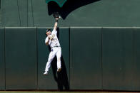 Oakland Athletics center fielder Skye Bolt misses a deep fly ball to allow a solo home run for Houston Astros' Kyle Tucker during the eighth inning of a baseball game in Oakland, Calif., Sunday, July 10, 2022. (AP Photo/John Hefti)