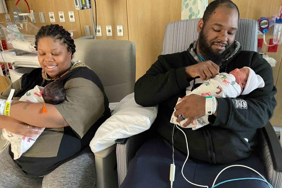 <p>Cone Health</p> From Left: Angelia Tutt and husband Elliott McNeil holding their newborn twins