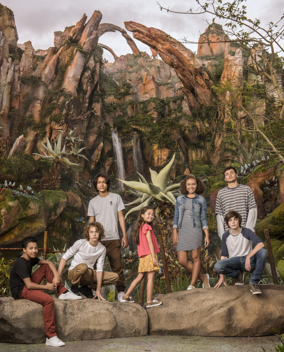 The next-generation <i>Avatar</i> cast: (L-R) Duane Evans Jr (Rotxo of the Metkayina Clan), Britain Dalton (Loâak of the Sully Family), Filip Geljo (Aonung of the Metkayina Clan), Trinity Bliss (Tuktirey of the Sully Family), Bailey Bass (Tsireya of the Metkayina Clan), Jack Champion (Javier ‘Spider’ Socorro), and Jamie Flatters (Neteyam of the Sully Family, standing). (Photo Credit: Sheryl Nields/20th Century Fox)