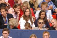 <p> Watching the Concert for Diana benefit at Wembley Stadium alongside siblings James and Pippa. </p>