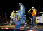 <p>Workers strap down the monument dedicated to U.S. Supreme Court Chief Justice Roger Brooke Taney on a flatbed truck after it was removed from outside the Maryland State House in Annapolis, Md., early Friday, Aug. 18, 2017. Maryland workers hauled several monuments away, days after a white nationalist rally in Charlottesville, Virginia, turned deadly. (Photo: Jose Luis Magana/AP) </p>