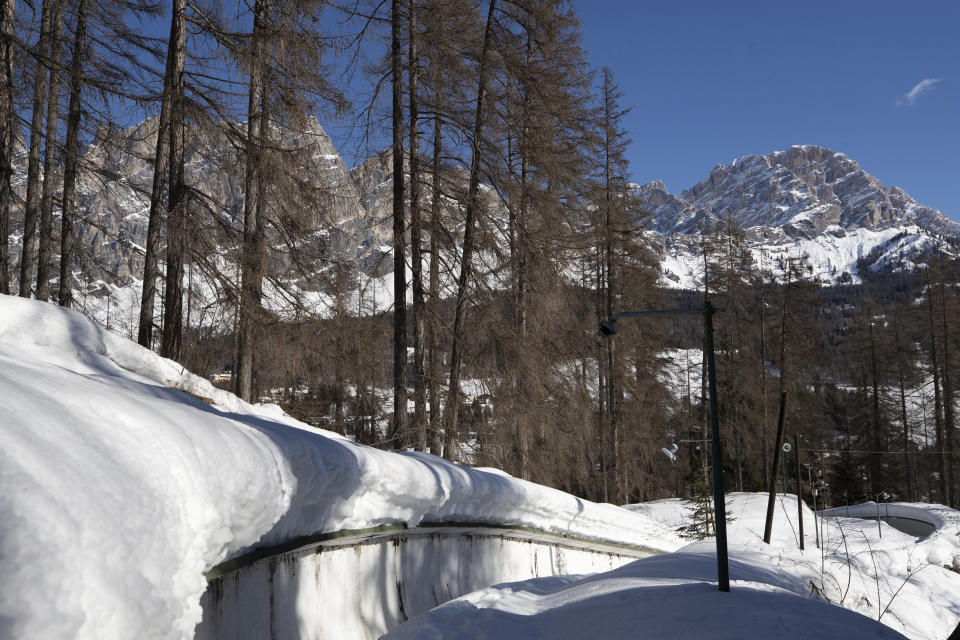 A view of the bobsled track in Cortina d'Ampezzo, Italy, Wednesday, Feb. 17, 2021. Bobsledding tradition in Cortina goes back nearly a century and locals are hoping that the Eugenio Monti track can be reopened for the 2026 Olympics in the Italian resort. (AP Photo/Gabriele Facciotti)