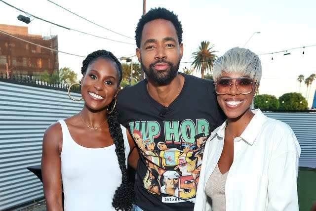 <p>Robin L Marshall/Getty</p> Jay Ellis, with Issa Rae and Yvonne Orji