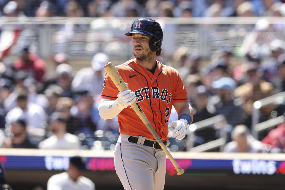 Houston Astros' Alex Bregman (2) walks off the field after hitting a ball to Minnesota Twins second baseman Donovan Solano for an out during the first inning of a baseball game, Saturday, April 8, 2023, in Minneapolis. (AP Photo/Stacy Bengs)