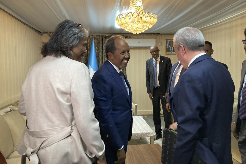 The U.S. ambassador to the United Nations, Linda Thomas-Greenfield, left, meets with Somali President Hassan Sheikh Mohamud, center, accompanied by U.S. ambassador to Somalia Larry Andre, right, in Mogadishu, Somalia Sunday, Jan. 29, 2023. The first U.S. Cabinet member to visit Somalia in nearly a decade is urging the world's distracted donors to give immediate help to a country facing deadly famine, which she calls "the ultimate failure of the international community." (AP Photo/Cara Anna)