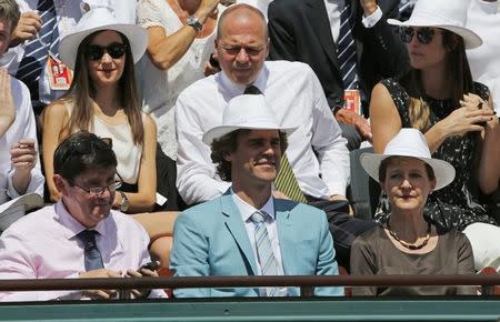 (L-R bottom) French Youth and Sports Minister Patrick Kanner , Former Brazilian tennis player Gustavo Kuerten and Swiss Justice Minister and President Simonetta Sommaruga watch the men's singles final match between Novak Djokovic of Serbia and Stan Wawrinka of Switzerland at the French Open tennis tournament at the Roland Garros stadium in Paris, France, June 7, 2015. REUTERS/Jean-Paul Pelissier