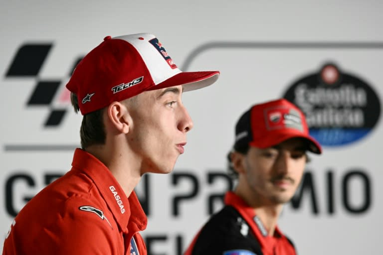 Pedro Acosta (L) answers a question in Jerez ahead of the MotoGP Spanish watched by world champion Francesco Bagnaia (JAVIER SORIANO)
