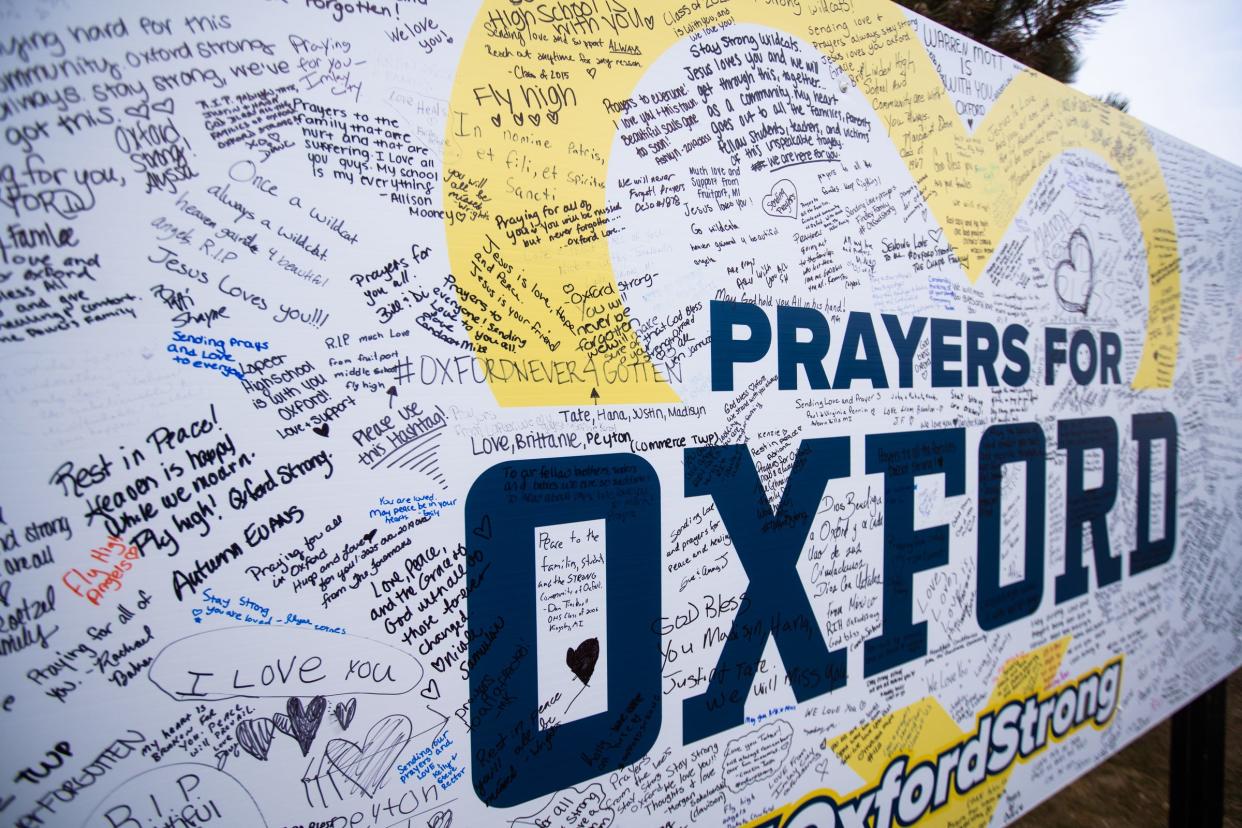 A message board is filled with messages as a memorial continues to grow at an entrance to Oxford High School on December 7, 2021, after an active shooter situation at Oxford High School that left four students dead and multiple others with injuries.